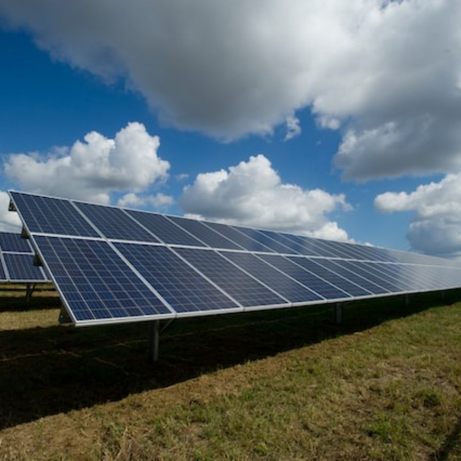 raised solar panels on a farm field
